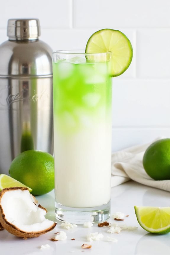 Refreshingly layered lime and coconut drink with ice, garnished with lime slice, perfect summer cocktail.