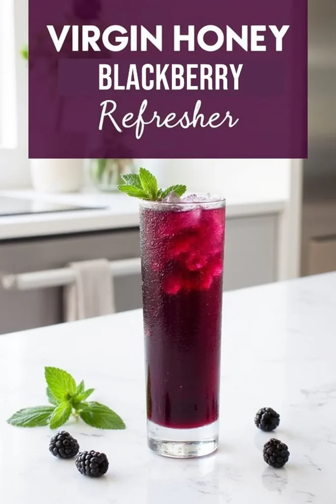 Refreshing virgin honey blackberry drink with mint on a marble counter, perfect for a summer cooler. Honey Blackberry Mint Mocktail