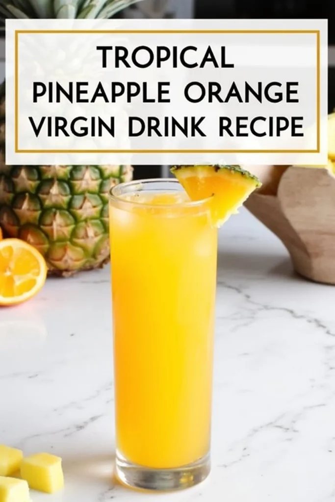 Tropical pineapple orange virgin drink recipe with fresh pineapple slice garnish in a tall glass. Refreshing and fruity.